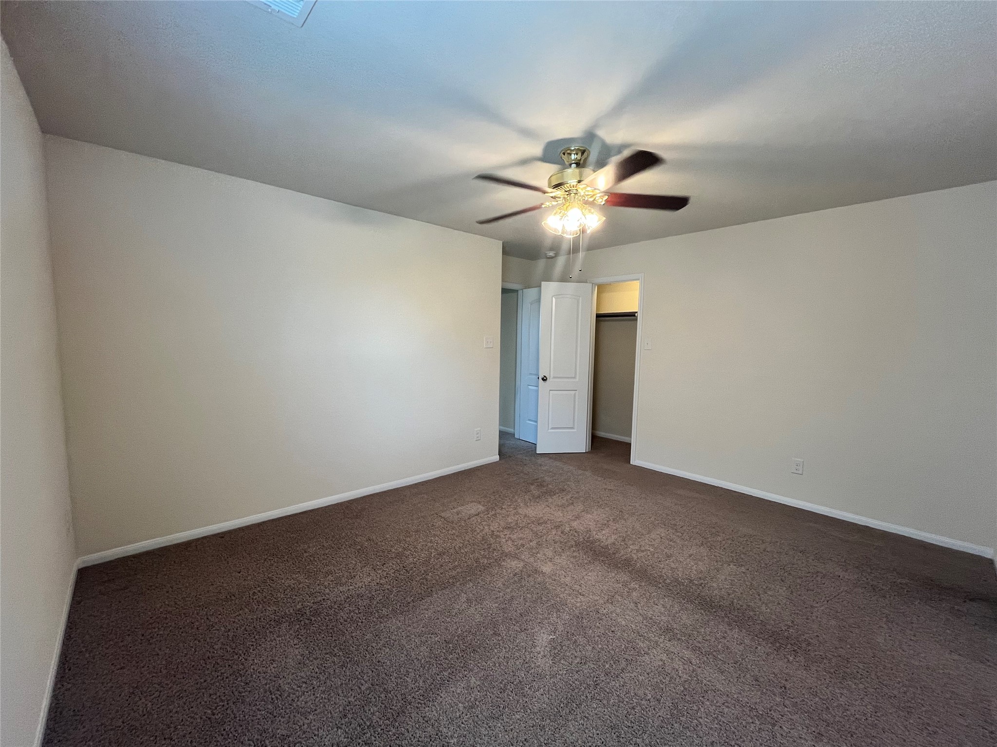 15103 Signal Ridge Way Cypress, TX 77429 - Photo 28 of 38 an empty room with a fan and a ceiling fan