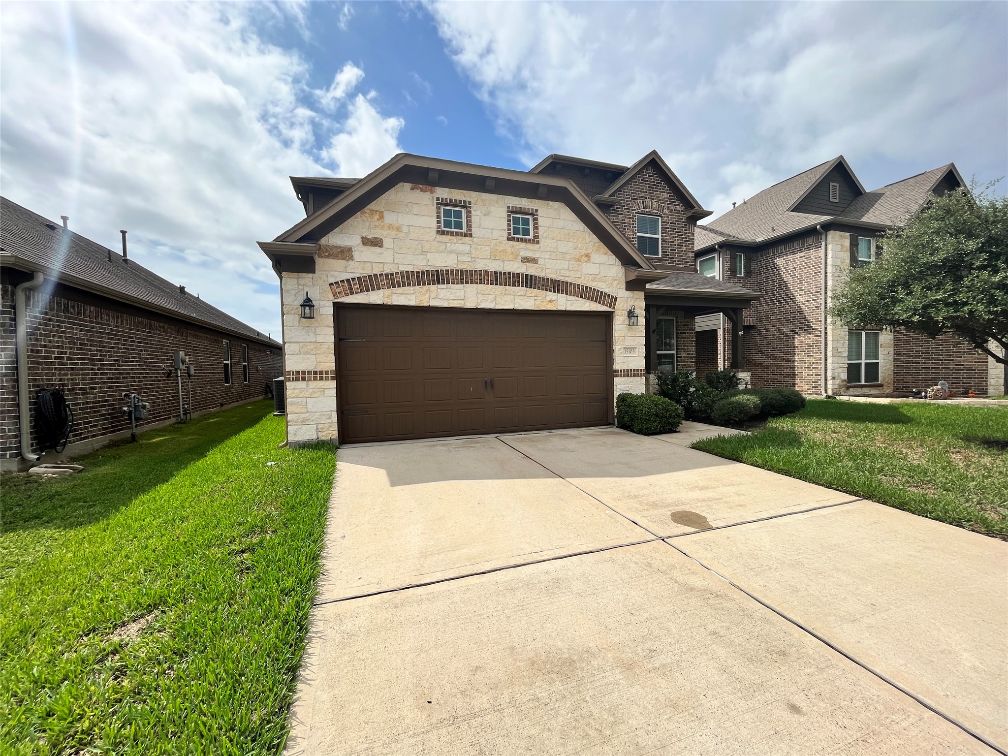 15103 Signal Ridge Way Cypress, TX 77429 - Photo 34 of 38 a front view of a house with a garden
