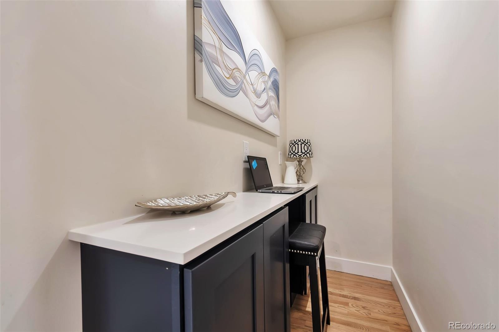 1417 Monroe Street Denver, CO 80206 - Photo 24 of 31 a kitchen with a sink and cabinets