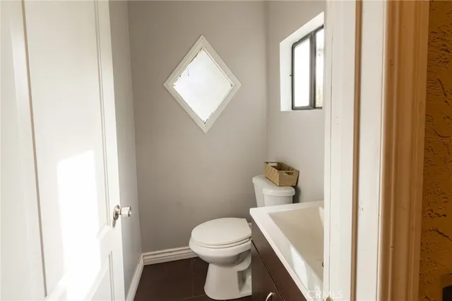 a bathroom with a toilet and a sink