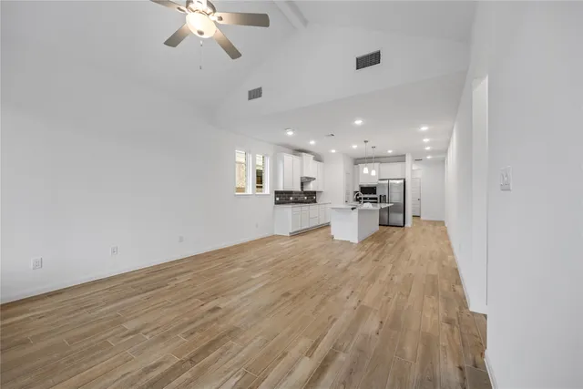 a view of kitchen with cabinets and wooden floor