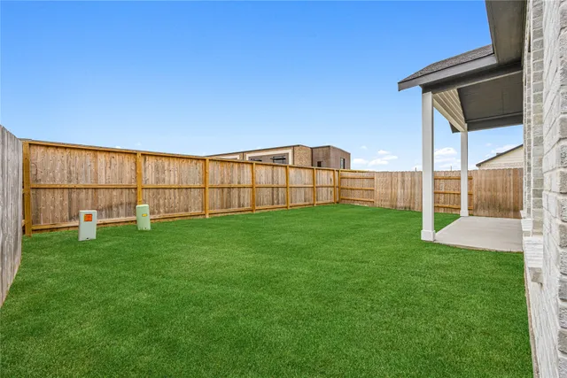 a view of a backyard with a garden