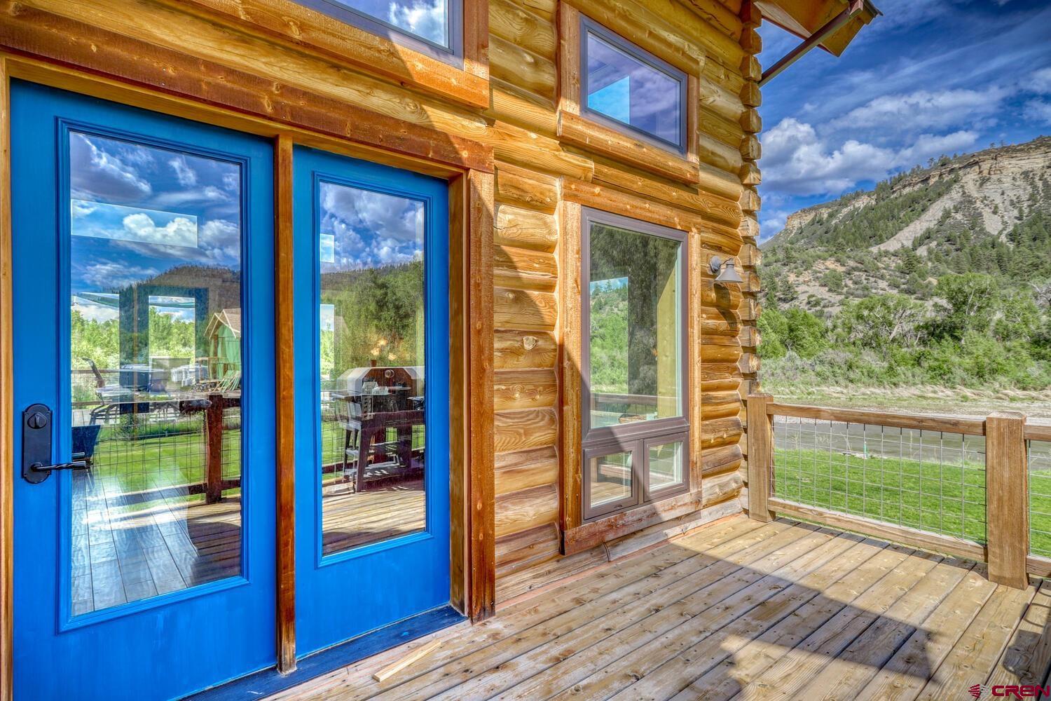 228 Estates Circle Road Pagosa Springs, CO 81147 - Photo 5 of 35 a view of a brick house with a large window