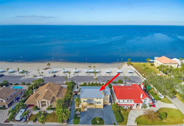 a view of a swimming pool and an outdoor seating
