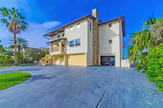 a view of a livingroom with wooden floor and a ceiling fan