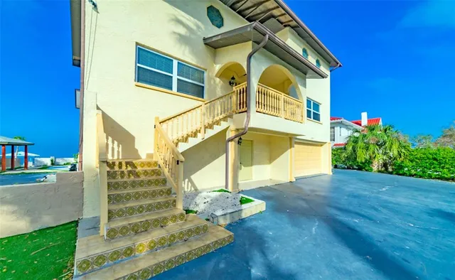 a view of a room with wooden floor cabinet and windows