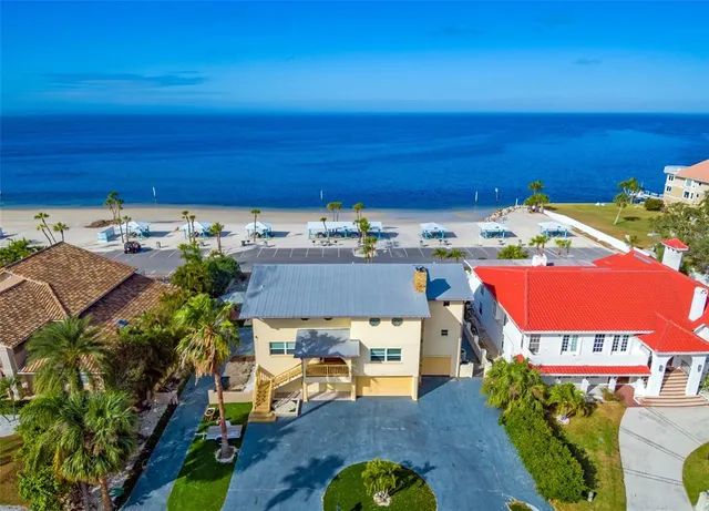 an aerial view of a houses with yard