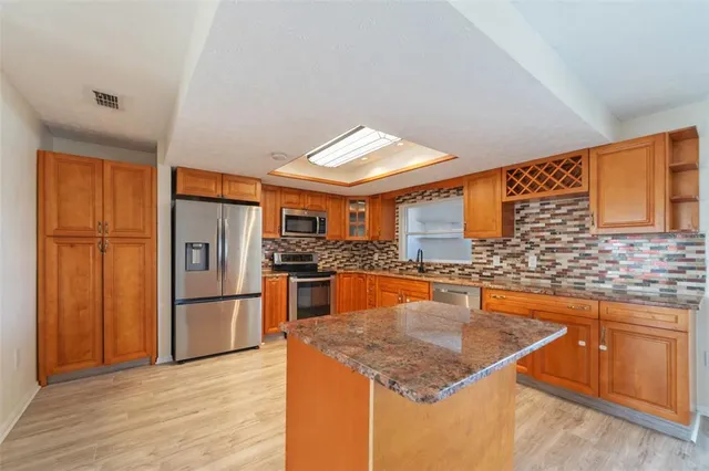 a bathroom with a window and a shower