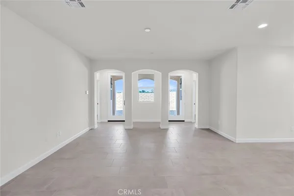 a view of an entryway with a hallway