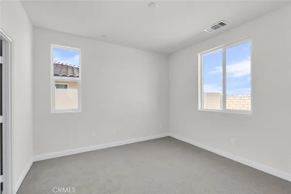 a view of a glass door and a window