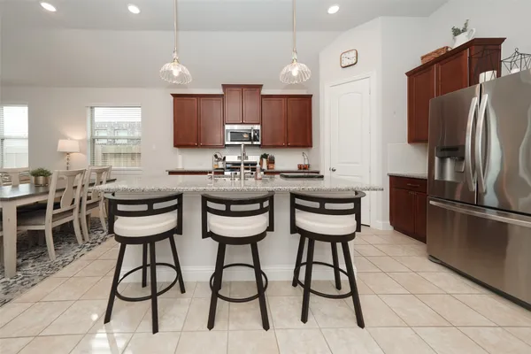 a kitchen with a sink cabinets and stainless steel appliances