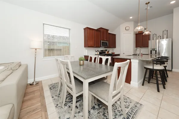 a view of a dining room with furniture