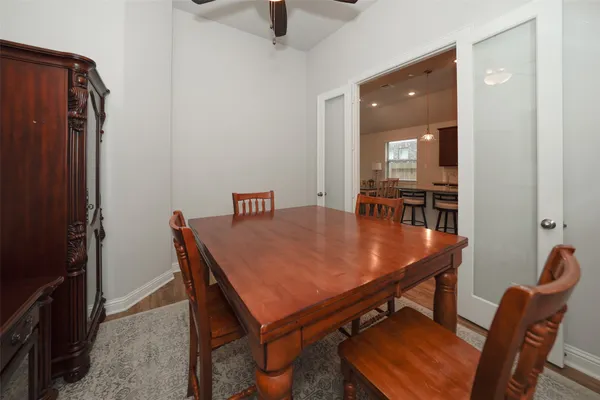 a dining room with furniture and window