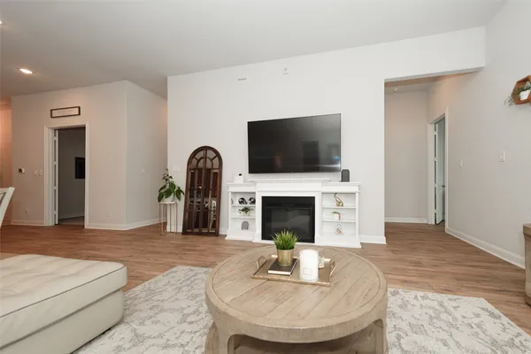 a living room with fireplace furniture and a flat screen tv