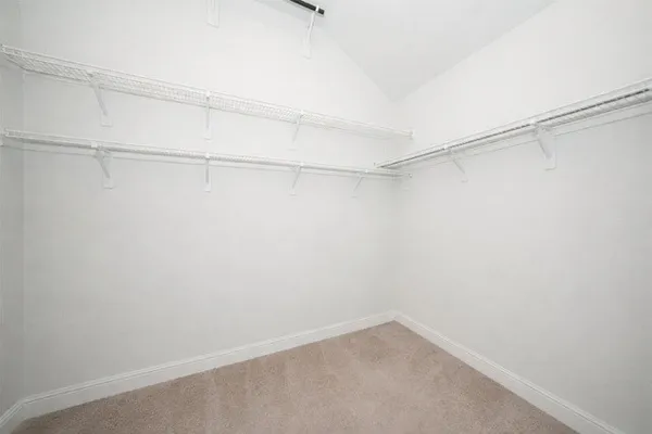 a view of a room with shelf on the wall