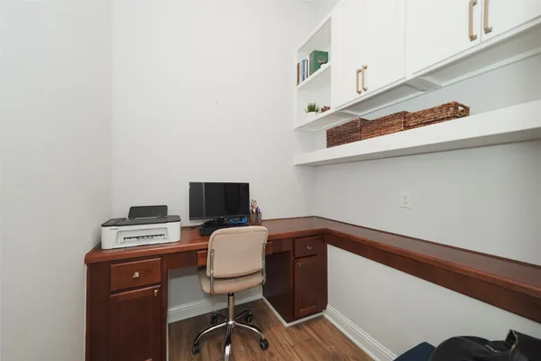 a view of a workspace with furniture