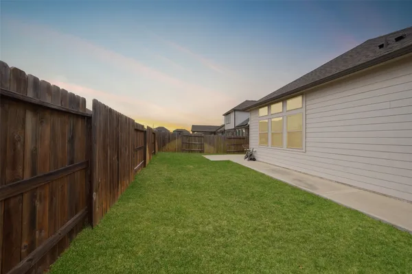 a backyard of a house with lots of green space
