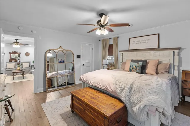 a bed room with a bed and a chandelier