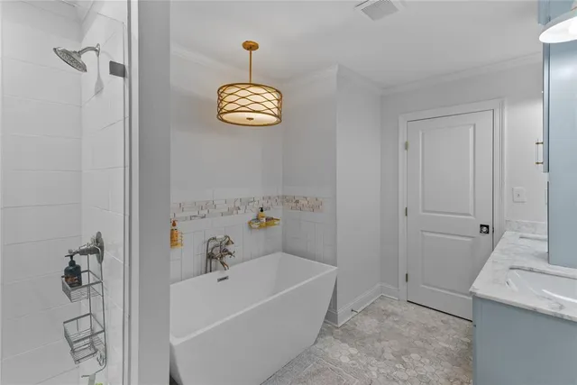 a bathroom with a bathtub and a shower