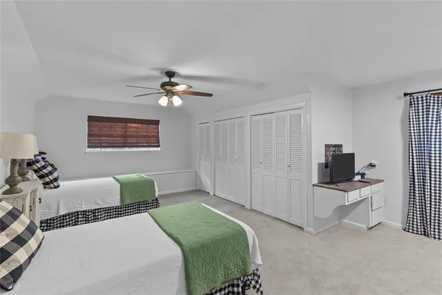 a bedroom with furniture and a window