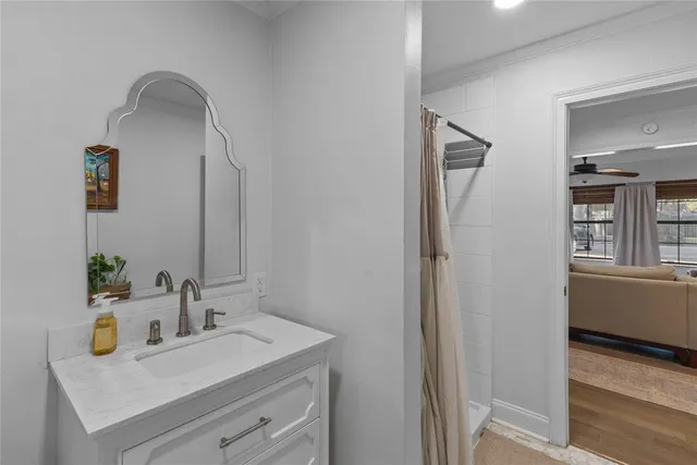a bathroom with a sink and a mirror