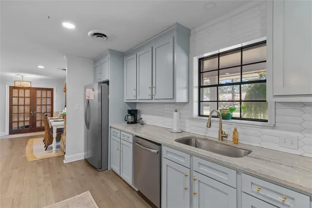 a kitchen with a sink and a window