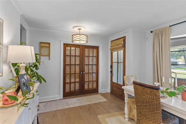 a view of an entryway with wooden floor