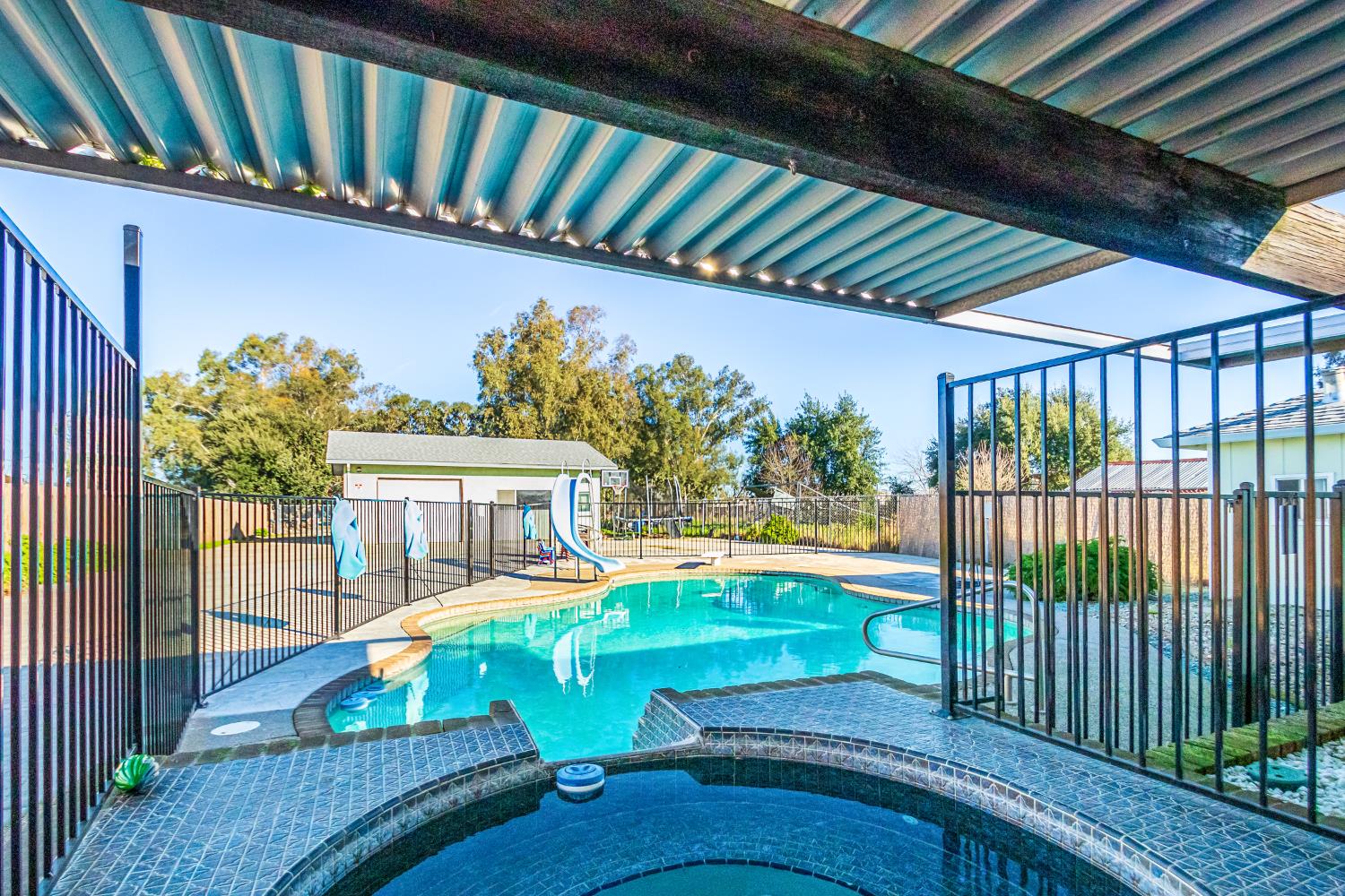 2423 I Street Rio Linda, CA 95673 - Photo 15 of 48 a view of a swimming pool with a patio