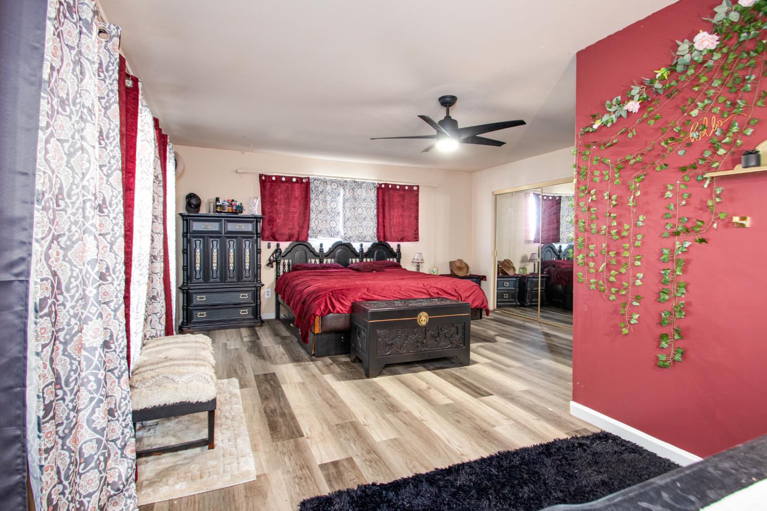 2423 I Street Rio Linda, CA 95673 - Photo 18 of 48 a spacious bedroom with a bed and a chandelier