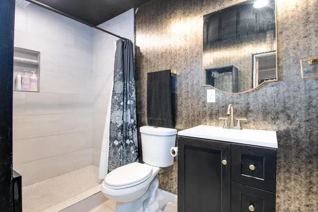 a kids room with a bed furniture and a window