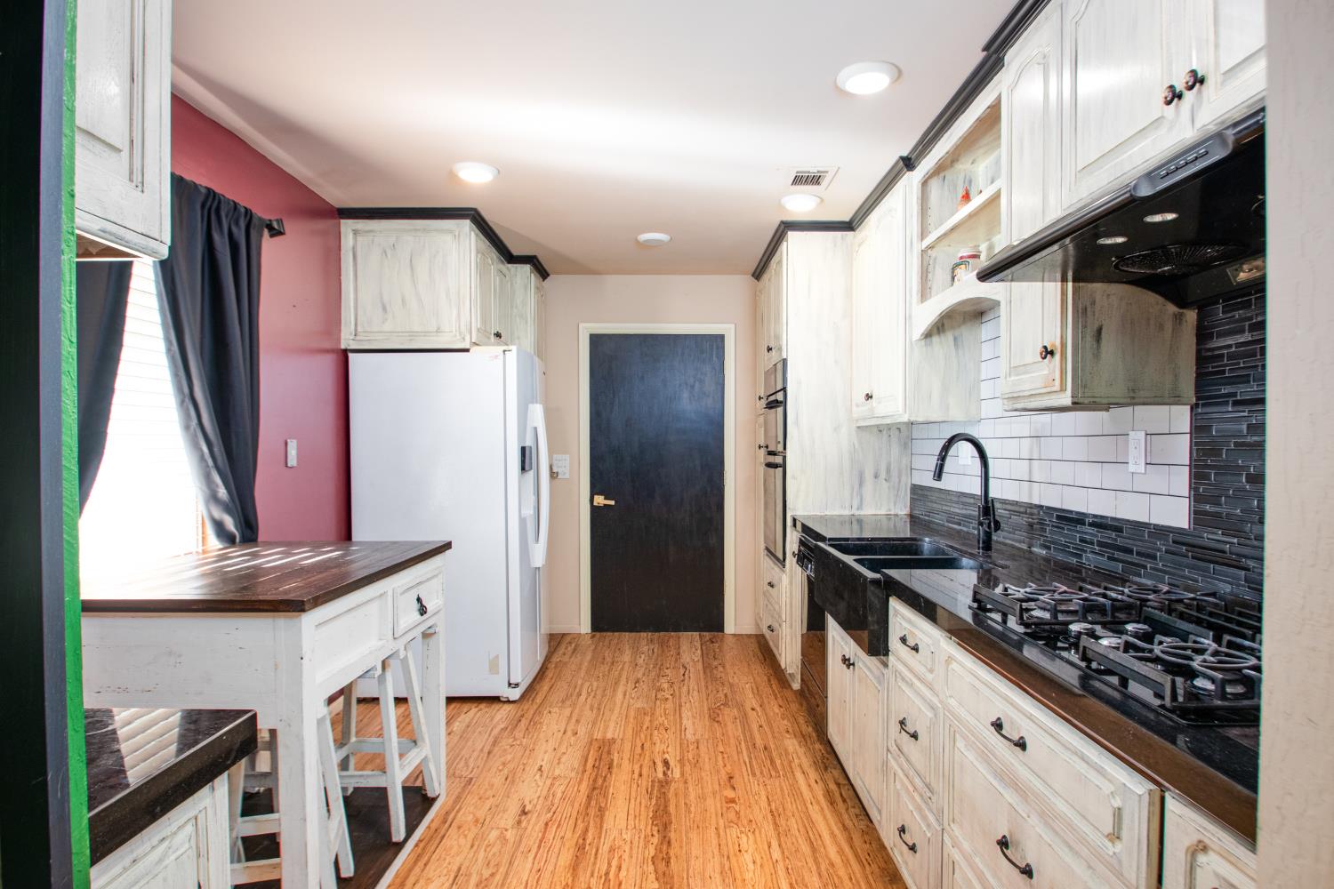 2423 I Street Rio Linda, CA 95673 - Photo 28 of 48 a kitchen with stainless steel appliances granite countertop a stove and a refrigerator