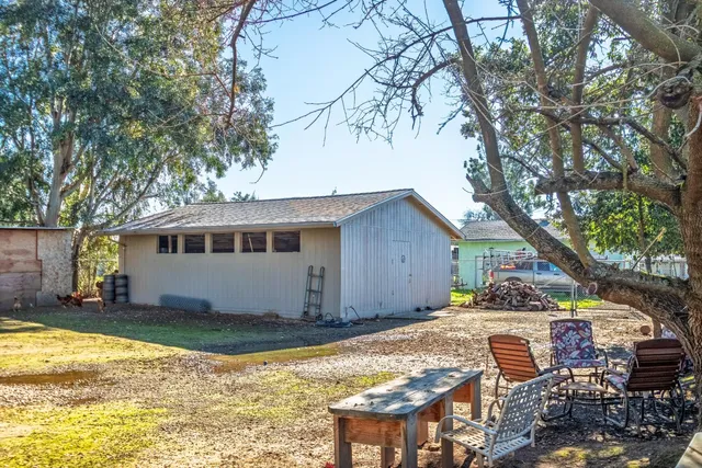 a view of a yard with swimming pool