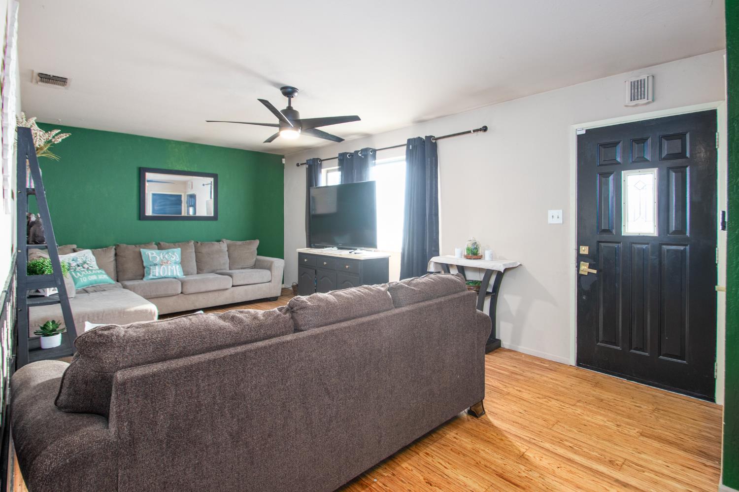 2423 I Street Rio Linda, CA 95673 - Photo 34 of 48 a living room with furniture and a wooden floor