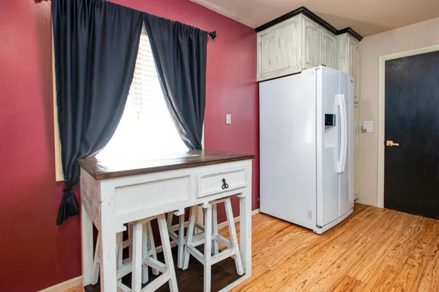 a kitchen with granite countertop cabinets and stainless steel appliances