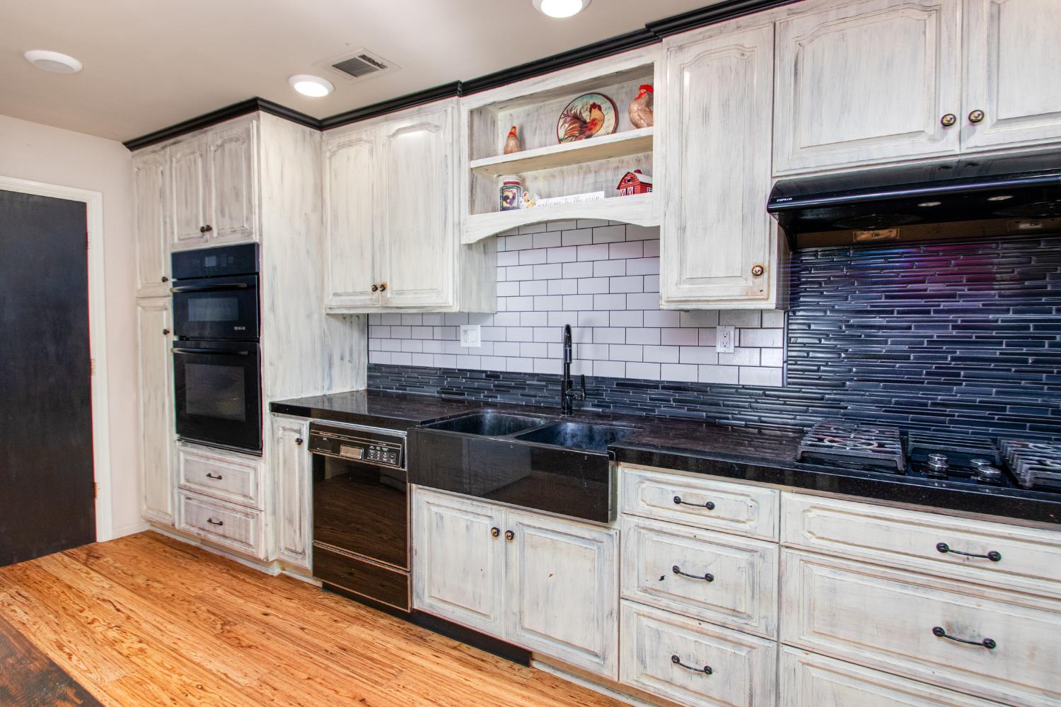 2423 I Street Rio Linda, CA 95673 - Photo 37 of 48 a kitchen with granite countertop cabinets and stainless steel appliances