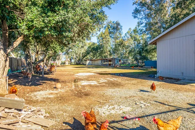 a view of swimming pool with an outdoor seating