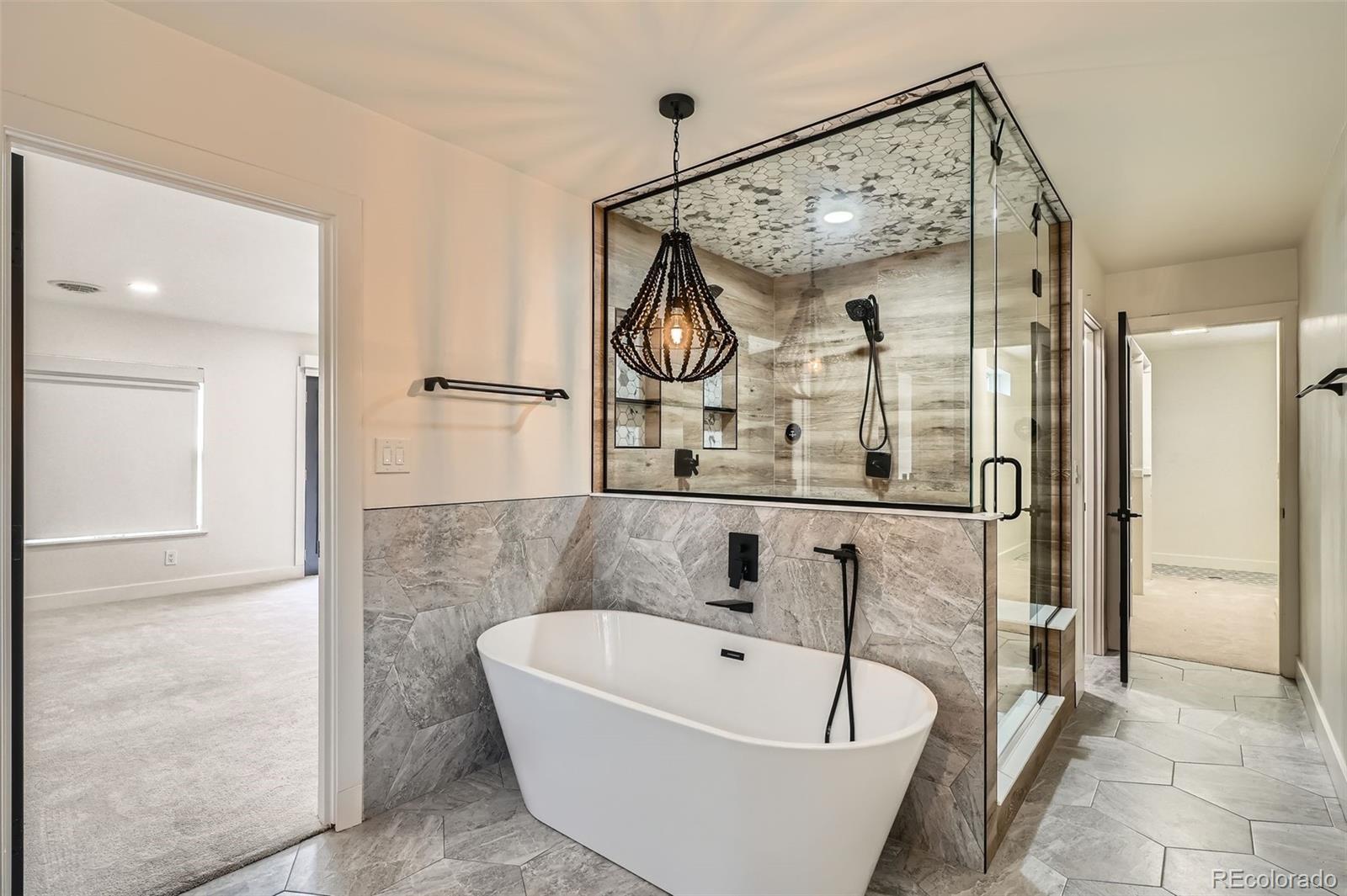 22 Rangeview Drive Wheat Ridge, CO 80215 - Photo 18 of 28 a bathroom with a bathtub and shower