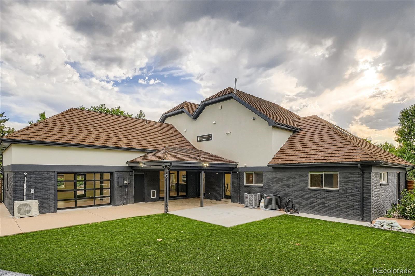 22 Rangeview Drive Wheat Ridge, CO 80215 - Photo 27 of 28 a front view of a house with a yard and trees
