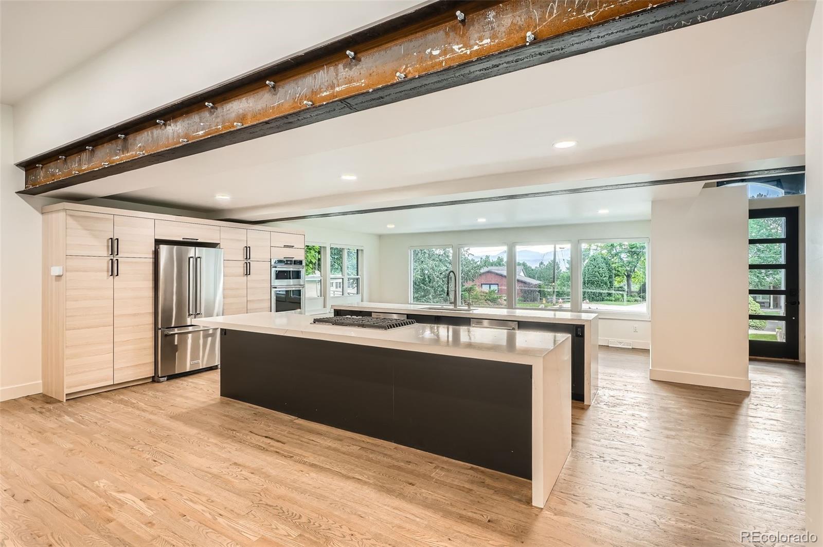 22 Rangeview Drive Wheat Ridge, CO 80215 - Photo 5 of 28 a view of kitchen with wooden floor and electronic appliances