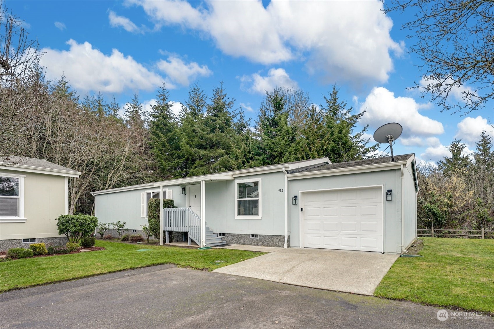 9421 21st Avenue East, Unit 42 Tacoma, WA 98445 - Photo 1 of 28 a front view of a house with garden