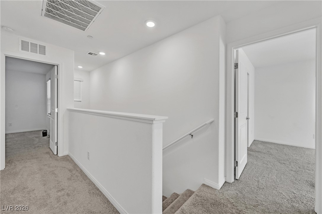 12283 Radiant Sunrise Road, Unit 3 Las Vegas, NV 89183 - Photo 9 of 42 Stairs oversized hallway