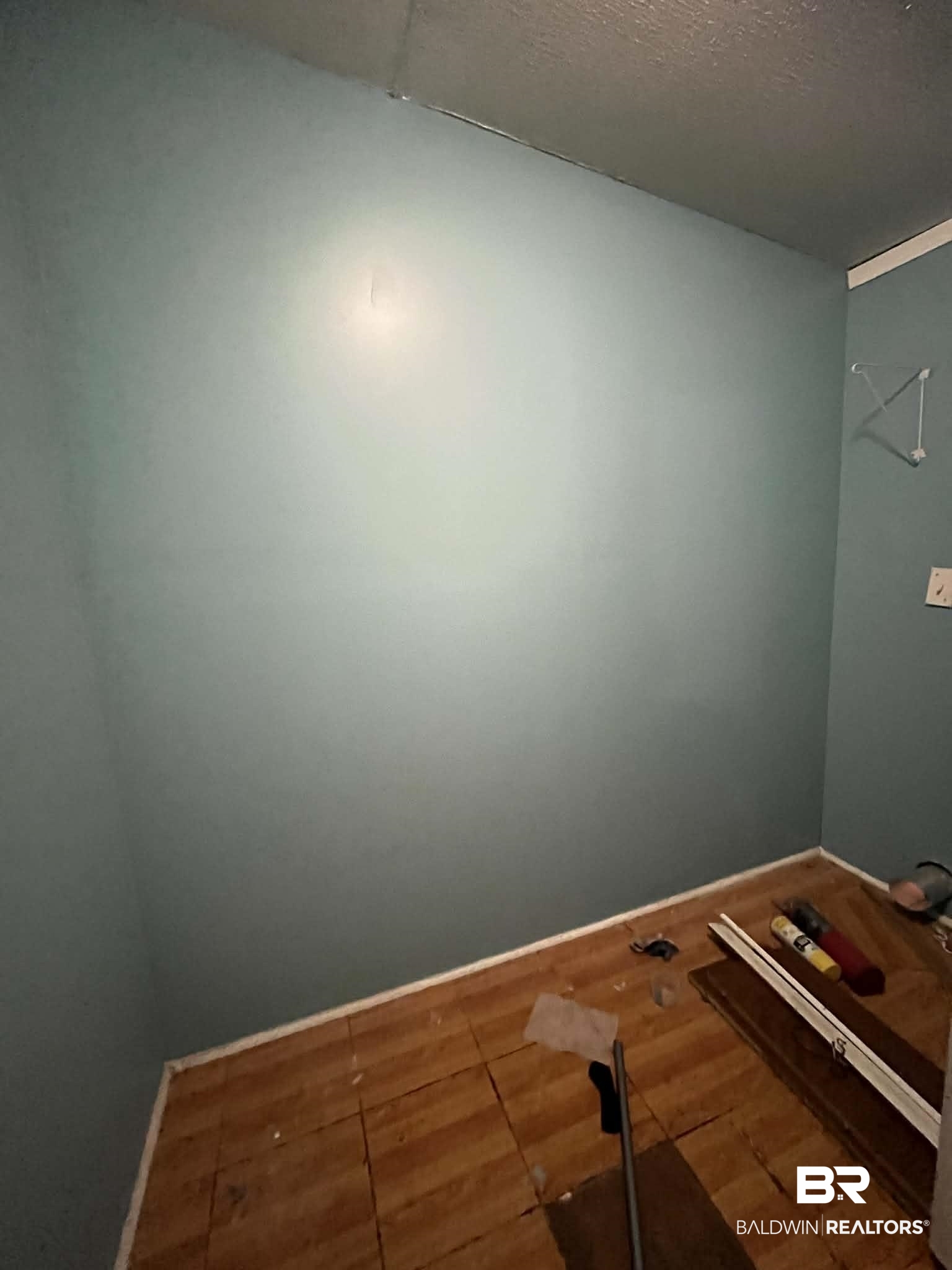 9628 Bryant's Lndg Road Stockton, AL 36579 - Photo 6 of 7 Empty room featuring baseboards and a textured ceiling