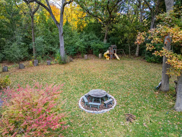 a backyard of a house with outdoor seating