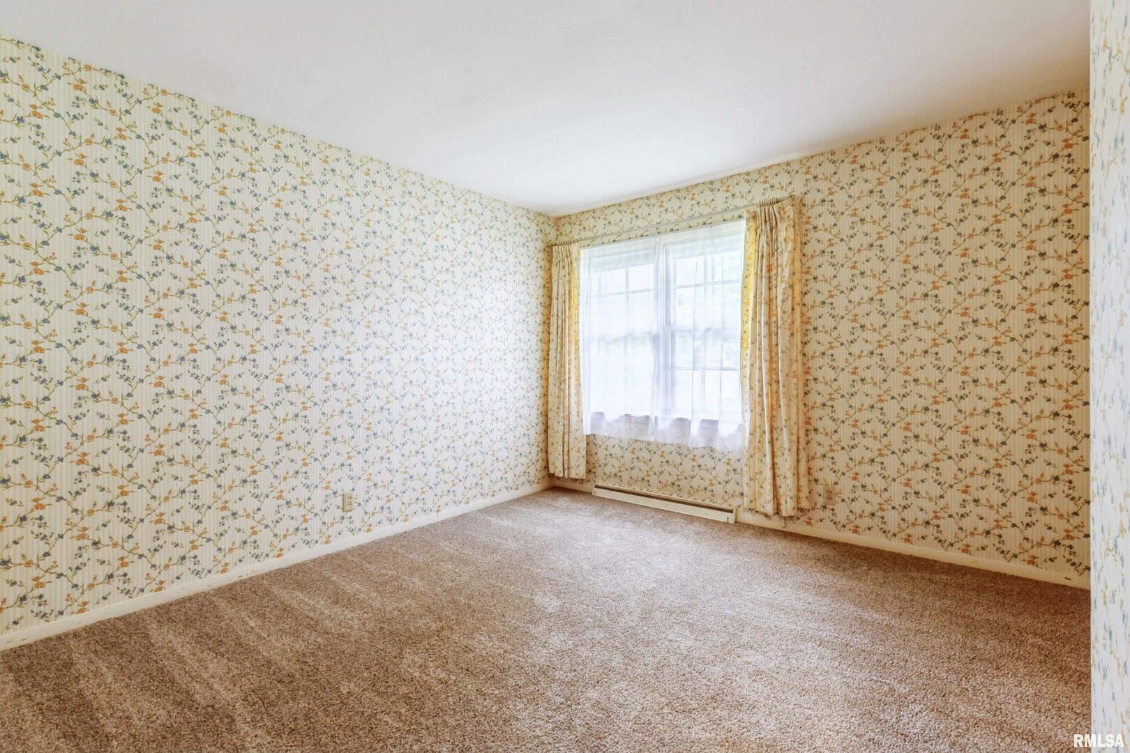 1136 Bobetta Court Clinton, IA 52732 - Photo 22 of 28 a view of an empty room with a window