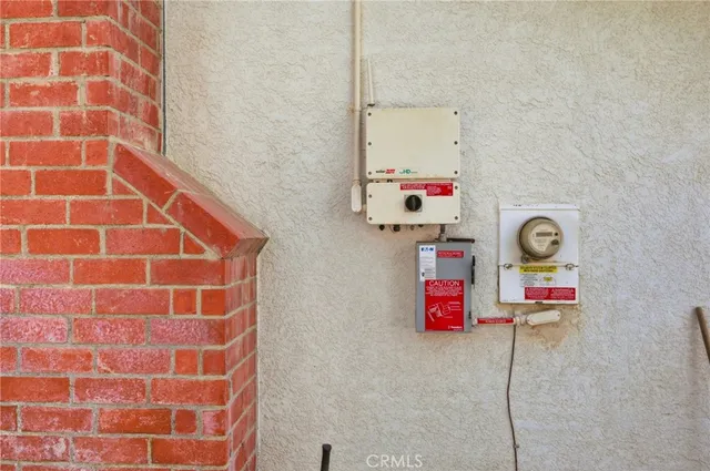 a view of a house with backyard sitting area and garden