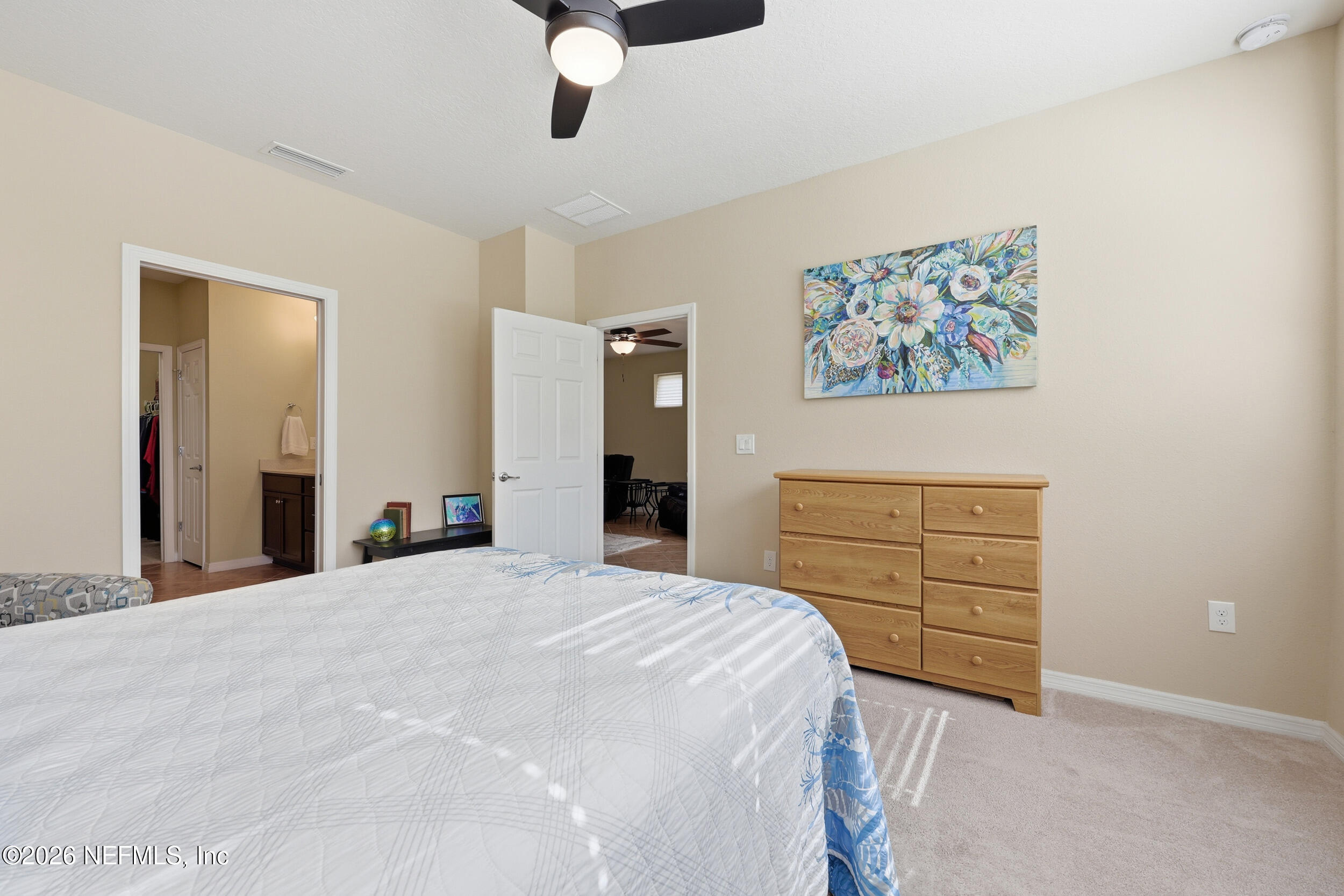 258 Rock Spring Loop St. Augustine, FL 32095 - Photo 16 of 31 a bedroom with a bed and a dresser