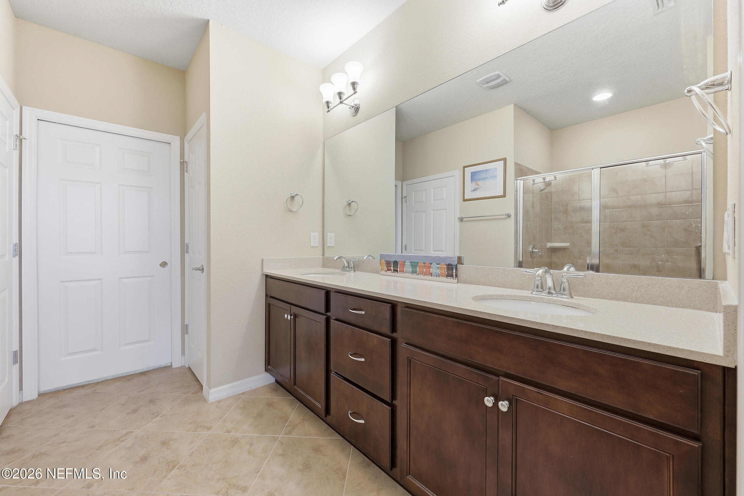 258 Rock Spring Loop St. Augustine, FL 32095 - Photo 18 of 31 a bathroom with a sink double vanity granite tub shower and a mirror