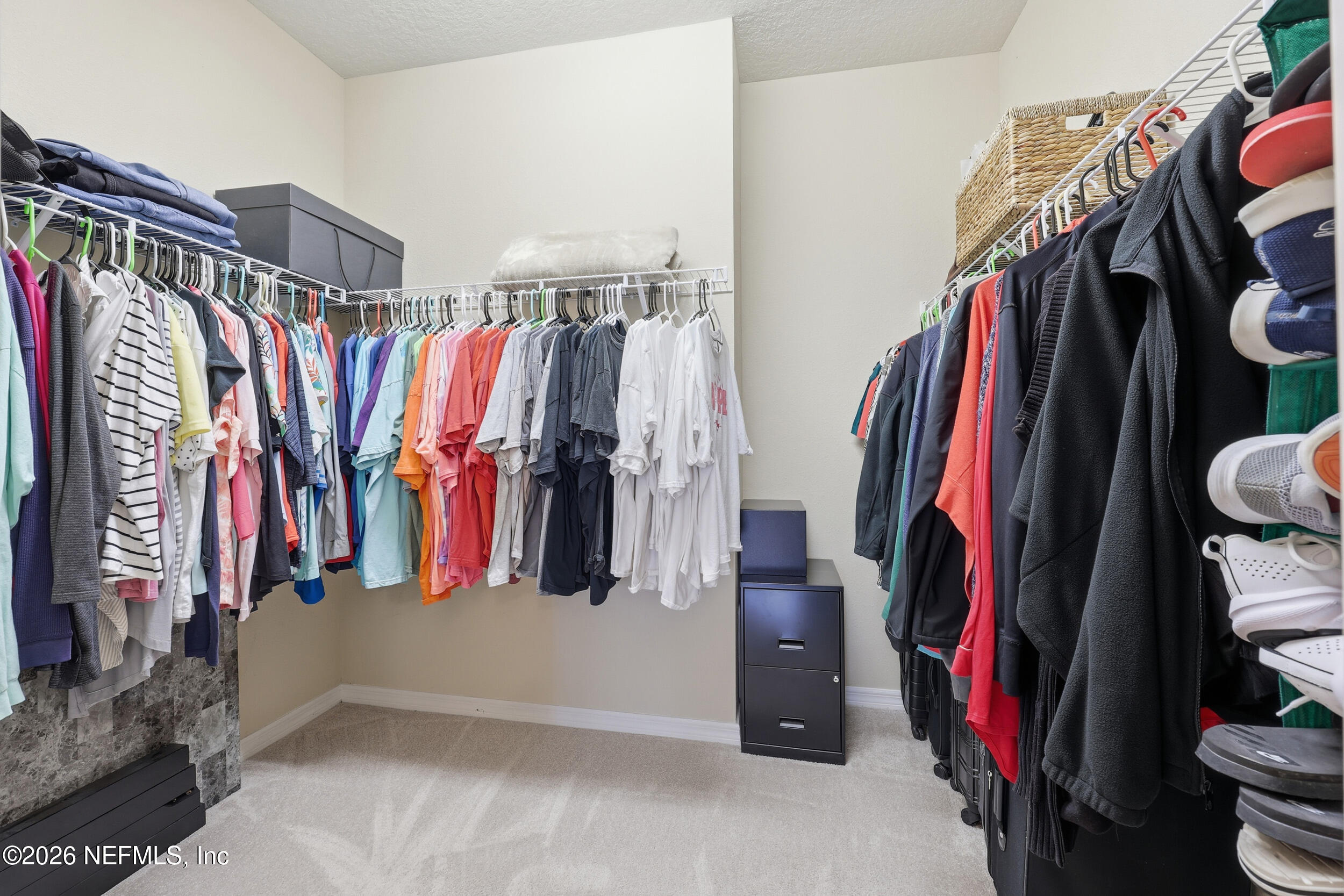 258 Rock Spring Loop St. Augustine, FL 32095 - Photo 20 of 31 a view of walk in closet with clothes