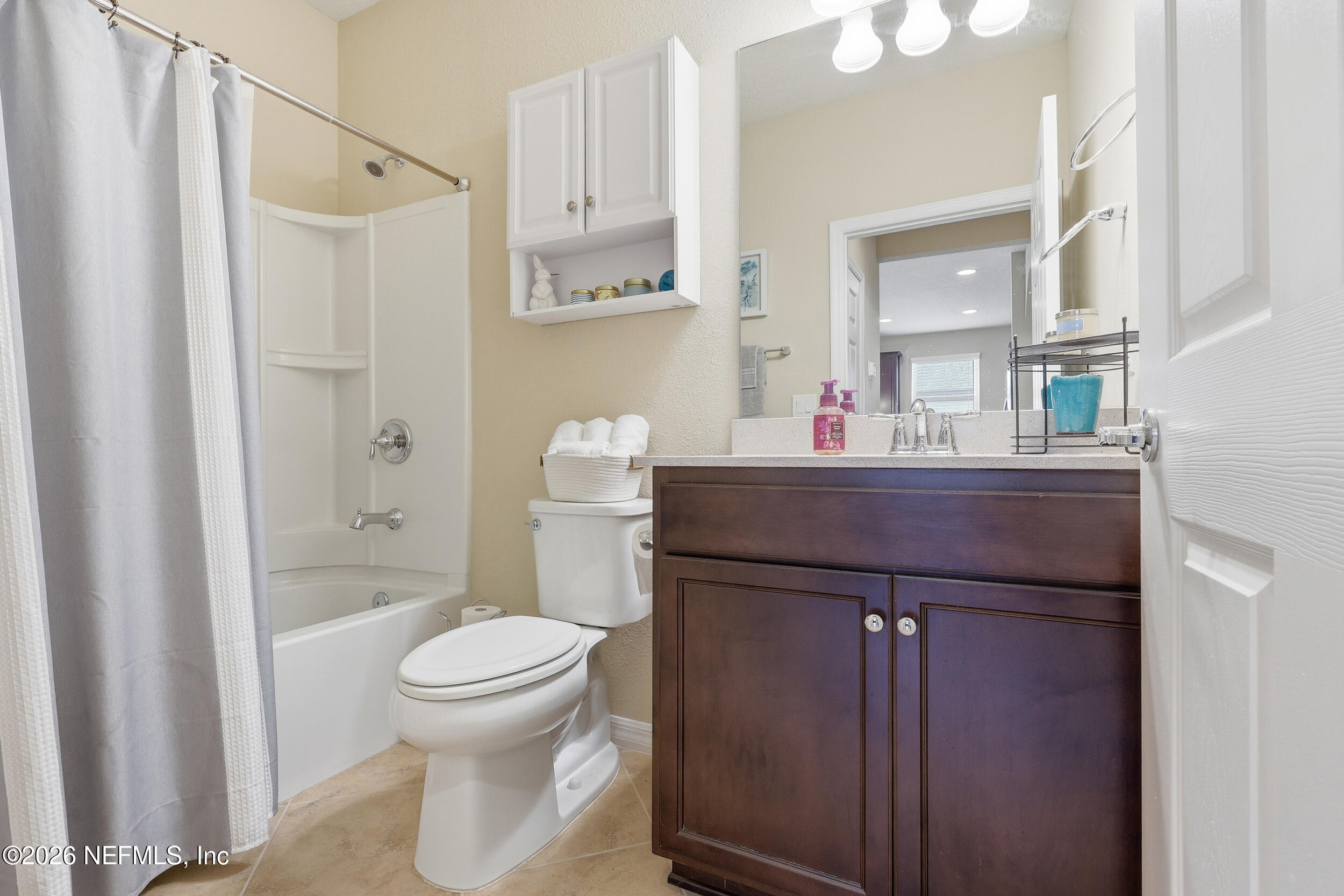 258 Rock Spring Loop St. Augustine, FL 32095 - Photo 22 of 31 a bathroom with a sink a toilet and shower