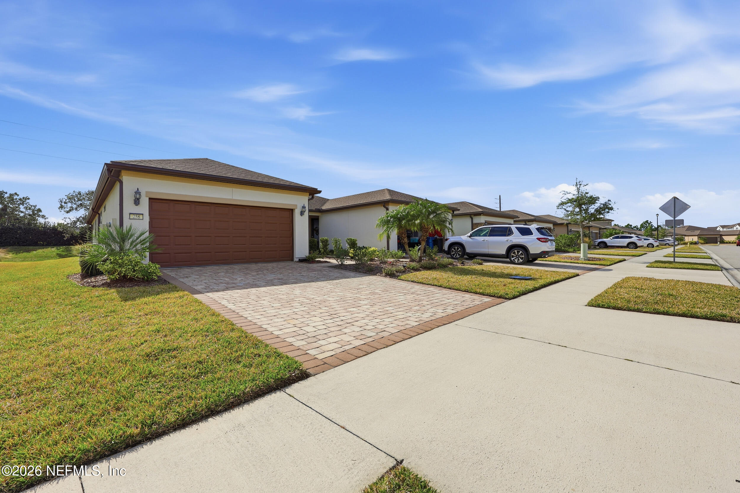 258 Rock Spring Loop St. Augustine, FL 32095 - Photo 30 of 31 a front view of a house with a yard